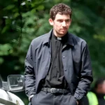 Wake Up Dead Man Josh O’Connor Black Jacket